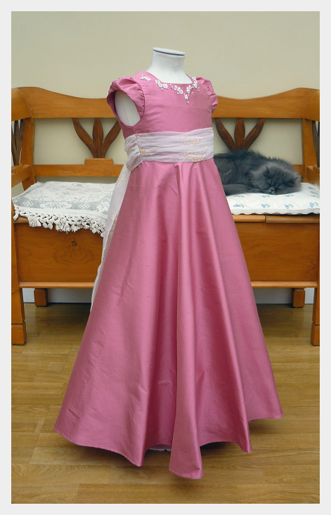 Flower girl dress by Felicity Westmacott in rose-pink silk dupion with organza sash and crystal applique
