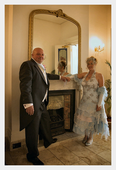 Wedding Dress by Felicity Westmacott, Angie's wedding day, standing by a fireplace